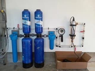 Installed water filtration equipment with connecting pipes and valves
